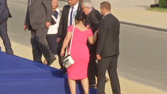 Jean-Claude Juncker stumbles and is helped by leaders at NATO gala