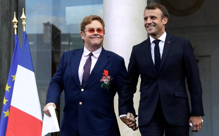 Elton John receives France’s highest honour after Paris concert